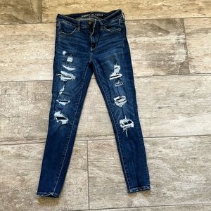 American Eagle size 4 dark Jeggings. Holes are covered, not open.